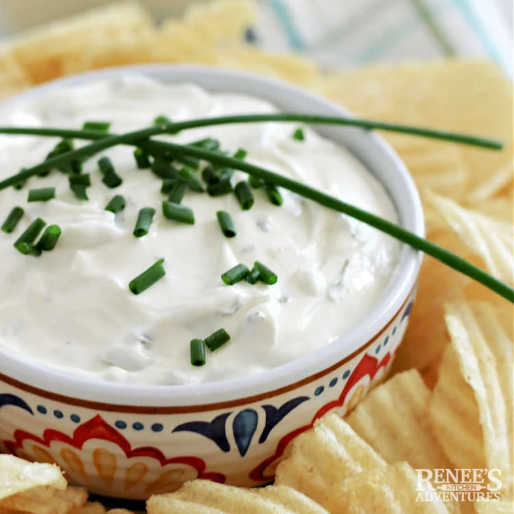 Lawson's Chip Dip in bowl, garnished with chives surrounded by chips