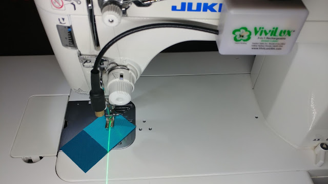 Using a sewing machine laser