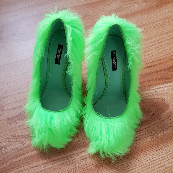 Dolce & Gabbana fluffy green shoes on wooden floor