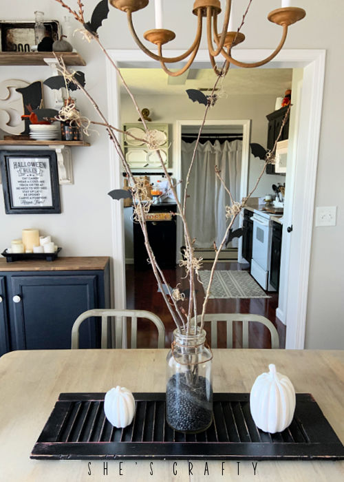 Halloween bat and branch table centerpiece -  bats and branches on a vintage shutter