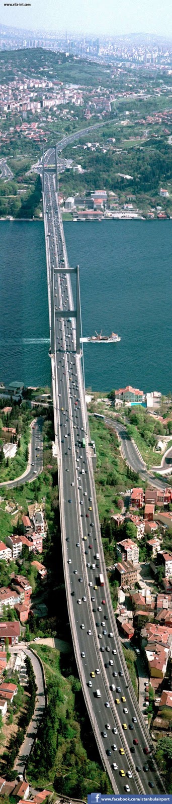 Bosphorus Bridge Istanbul. It is 1,510 m (4,954 ft) long with a deck width of 39 m (128 ft). The distance between the towers (main span) is 1,074 m (3,524 ft) and their height over road level is 105 m (344 ft)