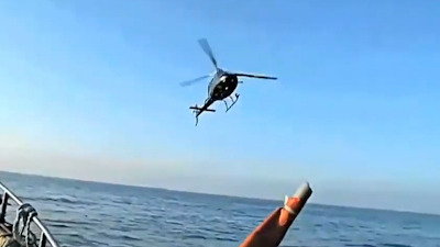 This is the shocking moment a helicopter literally threatens a fishing boat with it's entire crew on board about the UFO.