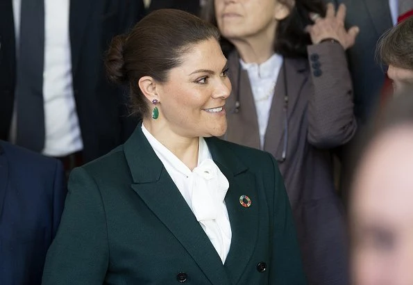 Crown Princess Victoria wore Tiger of Sweden Molena suit. Af Klingberg rakel taupe suede boots. Caroline Svedbom green earrings