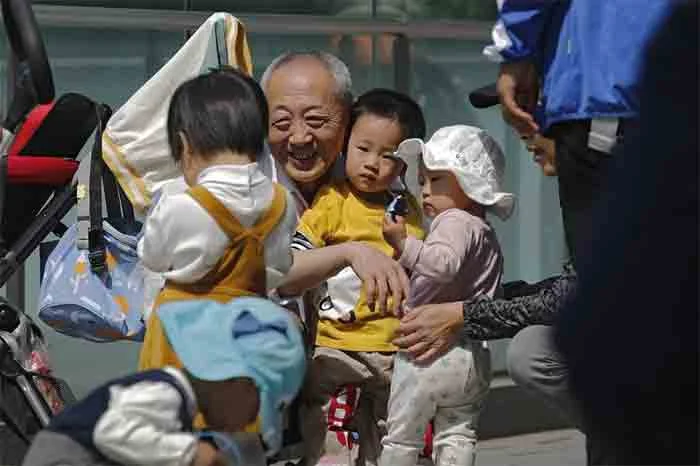 China easing birth limits further to cope with aging society, Beijing, China, Children, Economic Crisis, Family, Conference, World