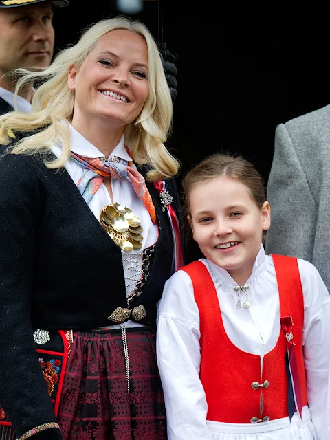 King Harald and Queen Sonja, Crown Prince Haakon of Norway and Crown Princess Mette-Marit of Norway with Princess Ingrid Alexandra, Prince Sverre Magnus and Marius Borg Høiby greet the Childrens Parade on the Skaugum Estate 