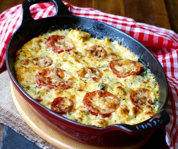 This Zucchini Tomato Gratin is one of my favorite summer dishes. It is really easy to make, and is a great way to use up all of your summer squash bounty. This Zucchini Tomato Gratin is one of my favorite summer dishes. It is really easy to make, and is a great way to use up all of your summer squash bounty.