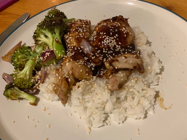 Hoisin chicken topped with sesame seeds, with jasmine rice and roasted broccoli