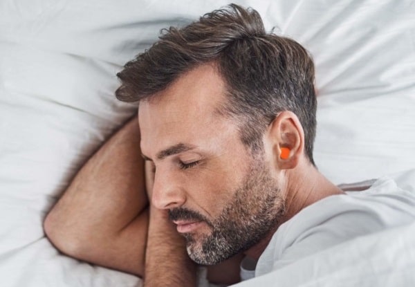 sleeping with ear plugs