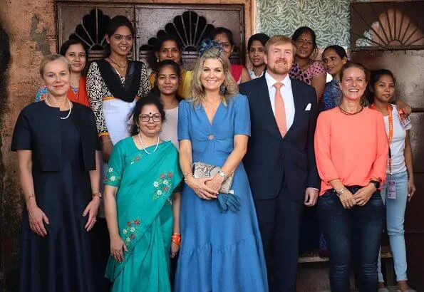 Queen Maxima wore Sandro blue ring detail midi dress. Queen Maxima wore a new turquoise green tulle dress by Natan