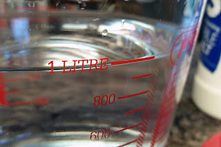 Showing one litre of water in a measuring jug