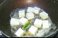 Sauteeing paneer cubes with butter, ginger and green chili for Paneer makhani recipe