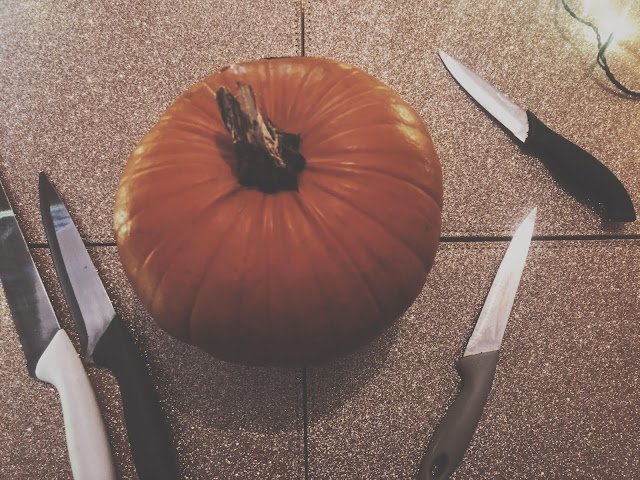 pumpkin with carving knives