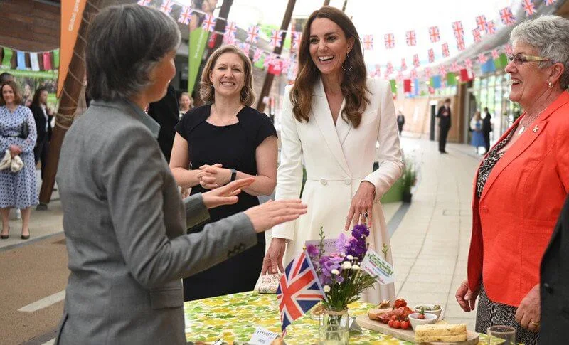 Queen in a floral outfit, Kate  in white coat dress, Carrie Johnson, wore a dressby Vampire’s Wife, Jill Biden in trench coat