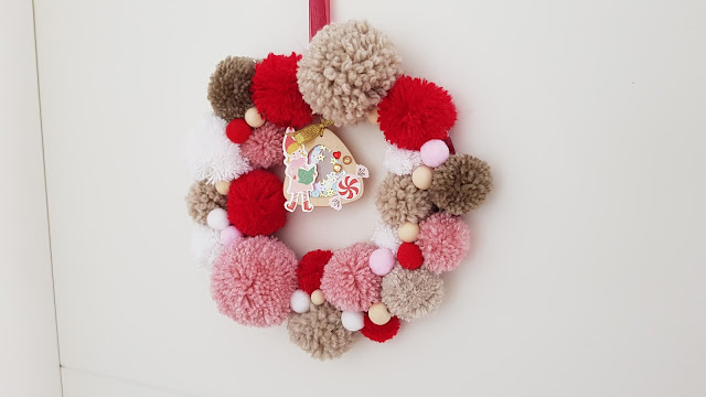 tutorial corona de navidad de pompones