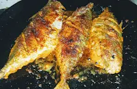 One side crisp golden fried mackerel bangda fish Tawa fry Recipe