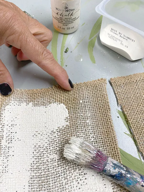 Painting a burlap flag white for the banner