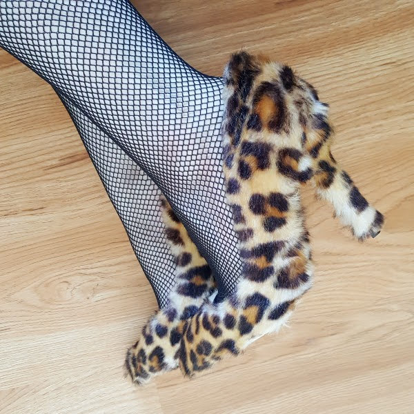 close up wearing fluffy fur fabric shoes in leopard print