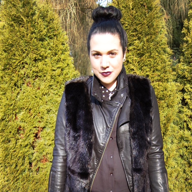 Black Simply Vera Wang faux fur vest, Mackage Kenya leather and a Celine Mini Luggage handbag.