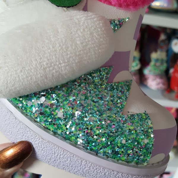 close up of green glitter section on ankle boot