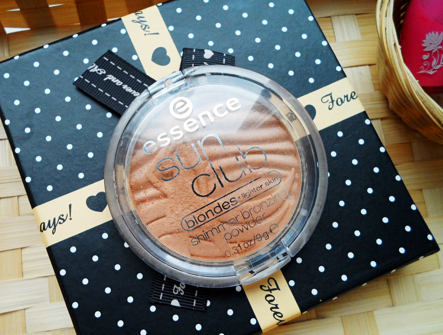 a close-up picture of bronzing makeup powder by essence