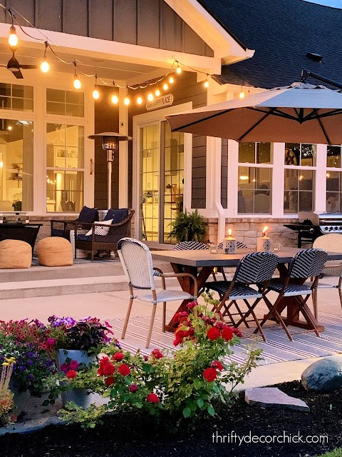 patio dining area with string cafe lights