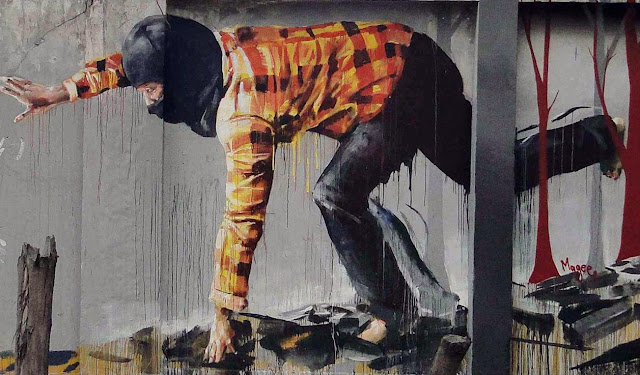 Australian Street Artist Fintan Magee paints a new mural entitled "Bad Hunter" on the streets of Bogota in Colombia. 4