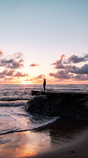 Lonely man, silhouette, rock, sea, sunset