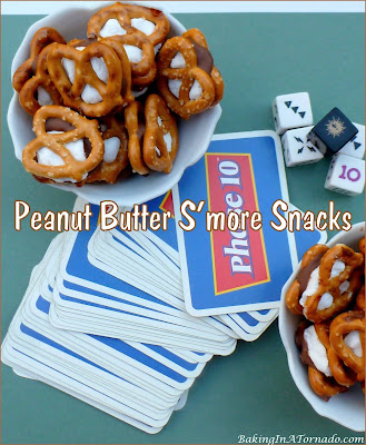 Peanut Butter S’more Snacks, a snack of threes, 3 ingredients, bake in 3 minutes, and disappear almost as fast. | recipe developed by www.BakingInATornado.com | #recipe #chocolate
