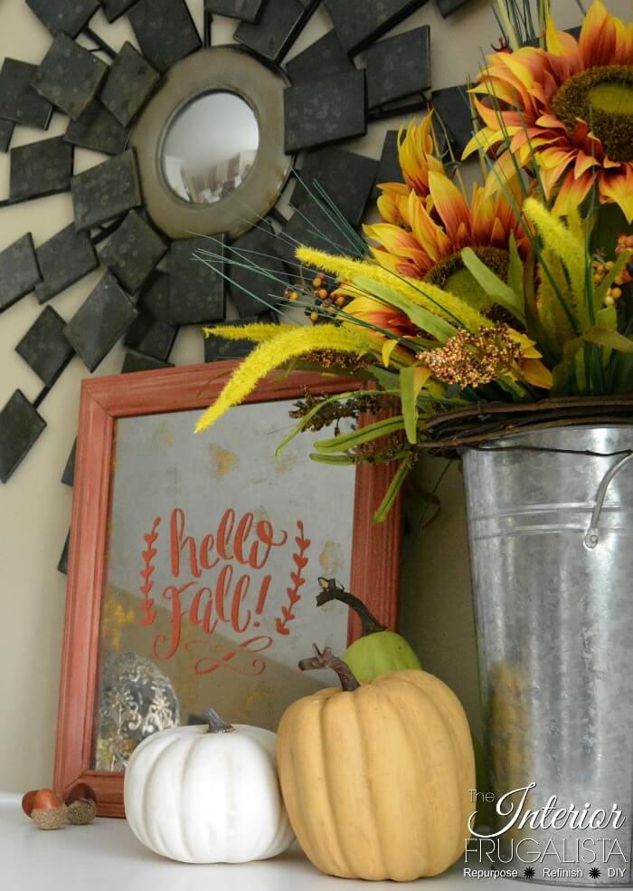How to turn thrift store picture frame glass into a reflective antiqued mirror plus how to add a Hello Fall stenciled sentiment for budget fall decor.