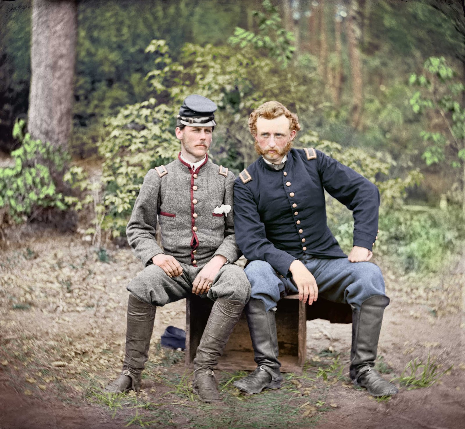 General Custer, (in blue), sitting with a Confederate Prisoner of war.