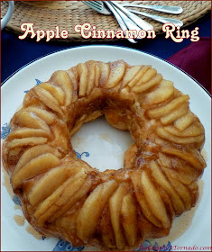 Apple Cinnamon Ring, a hot apple pie, cinnamon roll mash up. A beautiful dish that can be a breakfast, brunch, dessert or snack. | Recipe developed by www.BakingInATornado.com | #recipe #apple