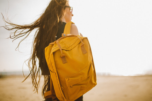Girl with a yellow backpack