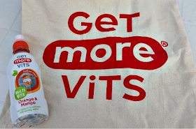A bottle of Get More Vits and a bag with the logo on.