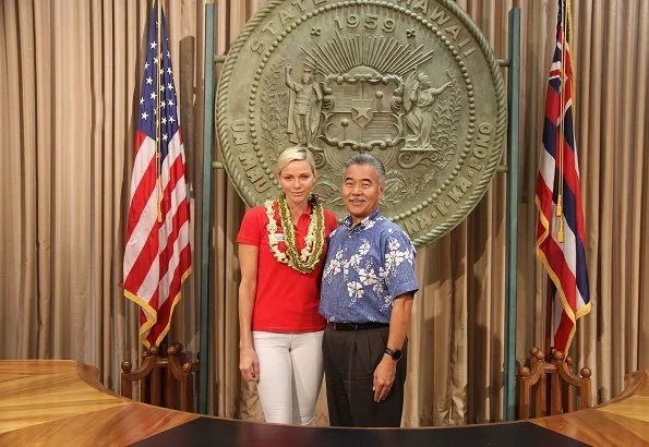 Princess Charlene of Monaco visited Honolulu, Hawaii met Governor David Idge. She wore red shirt and white pants