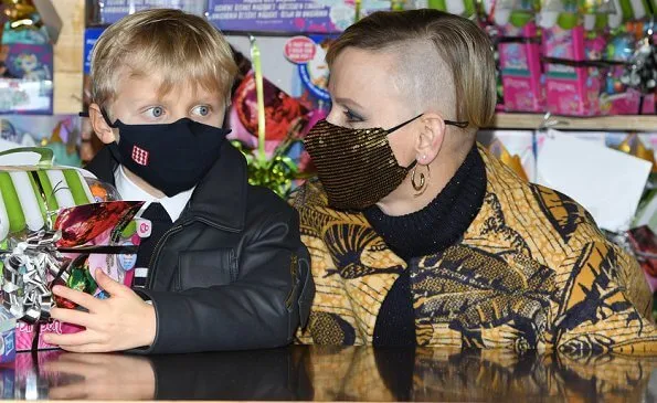 Prince Albert II, Princess Charlene, Hereditary Prince Jacques and Princess Gabriella. Princess Gabriella wore a new floral print raincoat from Jacadi