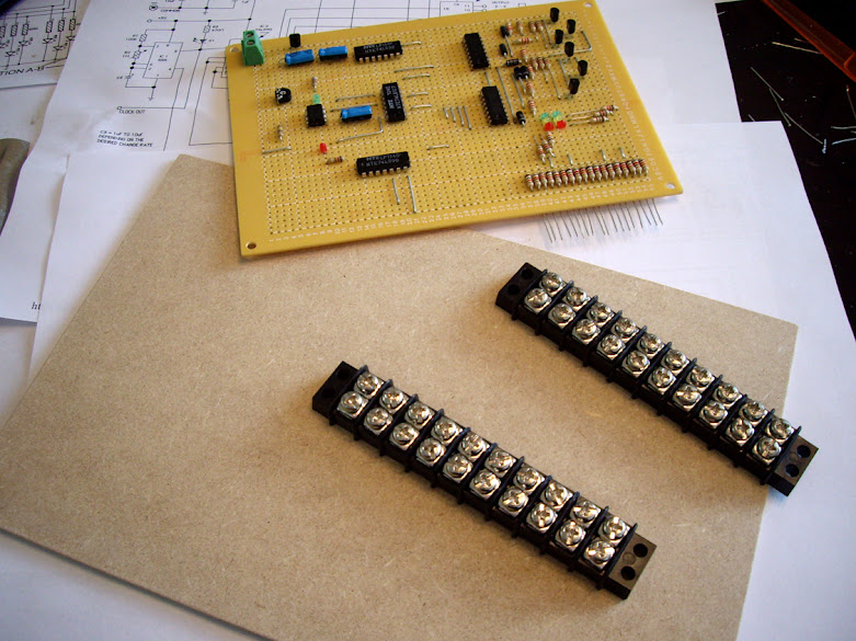 20 output traffic light controller and 2 terminal strips awaiting installation on a hardboard base