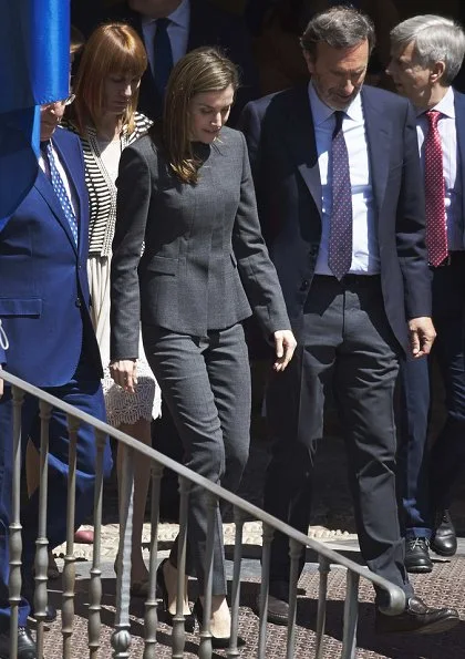 Queen Letizia wore Nina Ricci Pant Suit, Carolina Herrera patent and suede pumps and carried Uterque Studded messenger bag