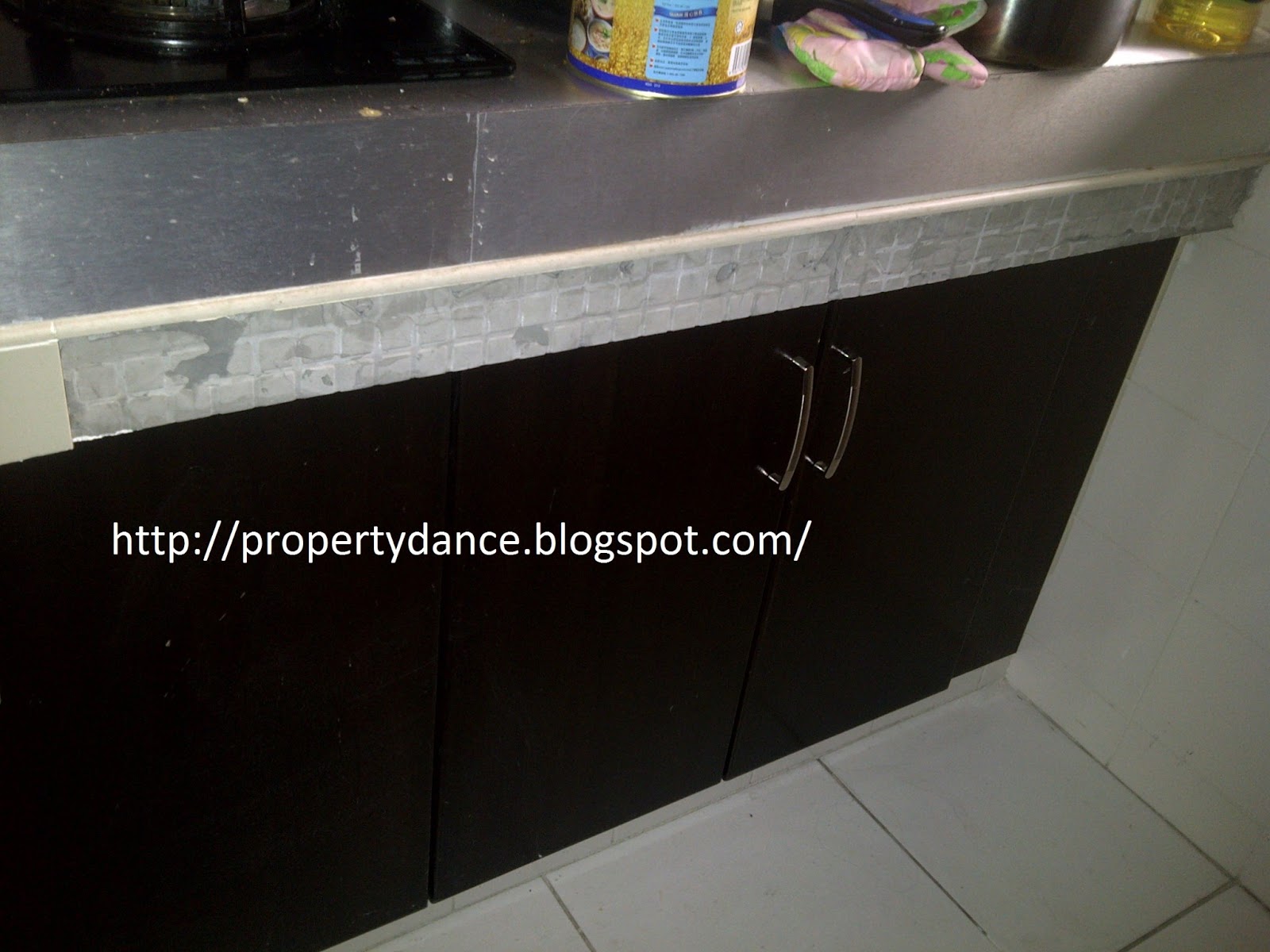 Property Dance Replacing Fallen Kitchen Tiles