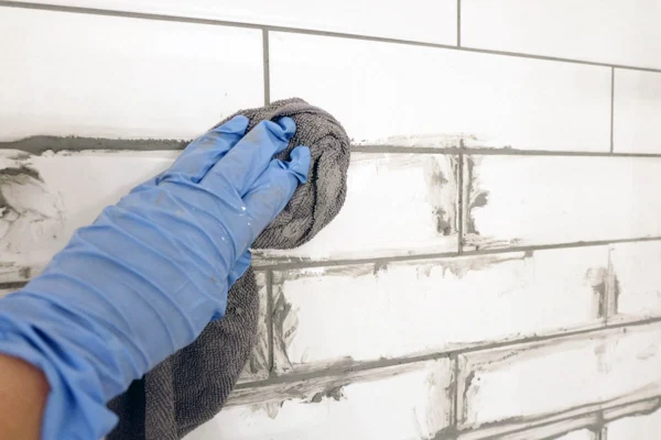 cleaning up the grout after using grout bag