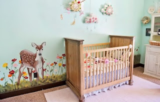 standard small cheap baby nursery green walls colour with average stuff racks decorated with a few photo frame and simple crib toys and dolls on shelf