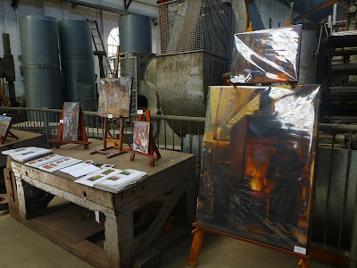 Exhibition of oil paintings in blacksmith's workshop, Eveleigh Railway Workshops painted during ATP Open Day by industrial heritage artist Jane Bennett