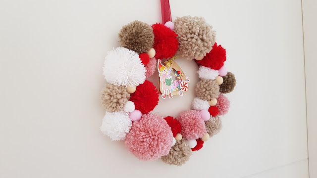 tutorial corona de navidad de pompones