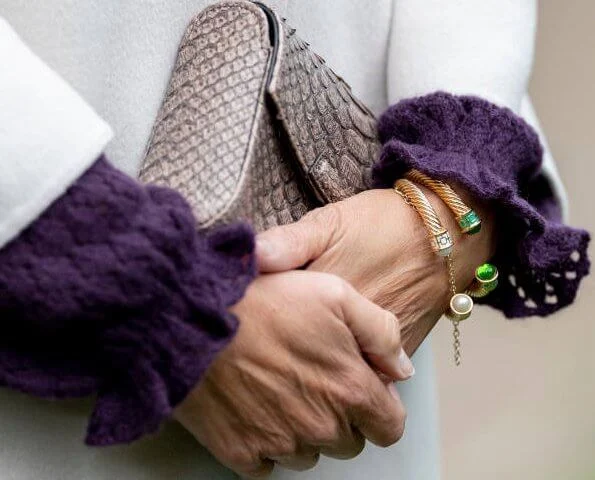 Prada coat, Monica Vinader Siren stud earrings, green trousers, Sophie Habsburg Amber clutch