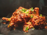 Serving masala chicken lollipop in a plate