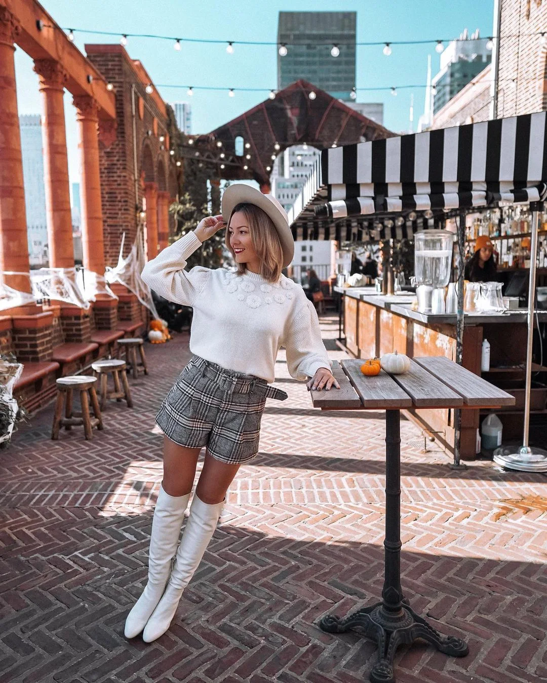 Long white boots and white sweater