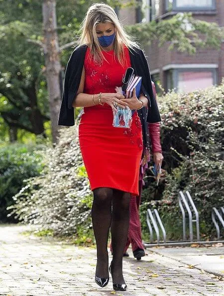 Queen Maxima wore a short sleeve red midi dress from Natan Edouard Vermeulen Fall-Winter 2016 collection