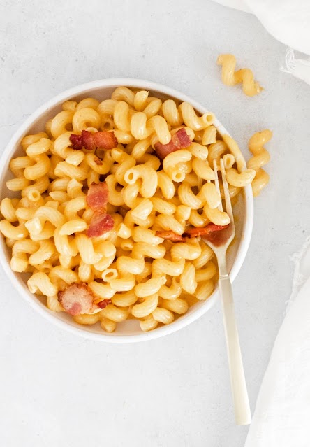 Instant Pot Bacon Macaroni and Cheese in a bowl with a fork