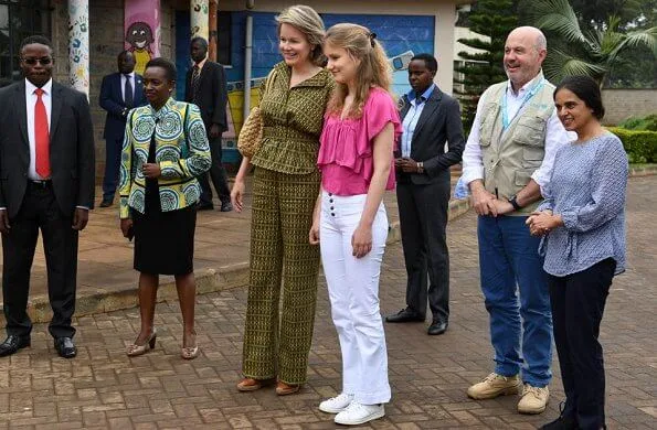 Queen Mathilde Dries Van Noten jacket and trousers, Natan dress, Crown Princess Elizabeth in Maje blouse and white trousers