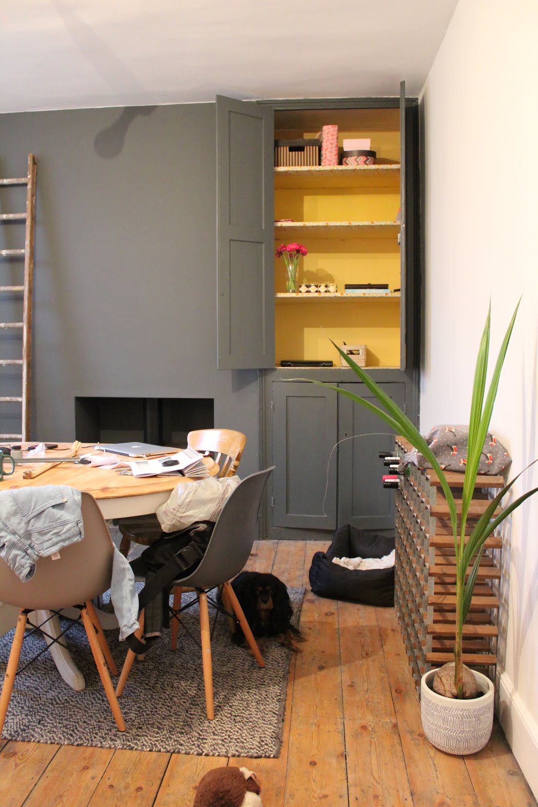 Yellow and Grey cupboard in dining room