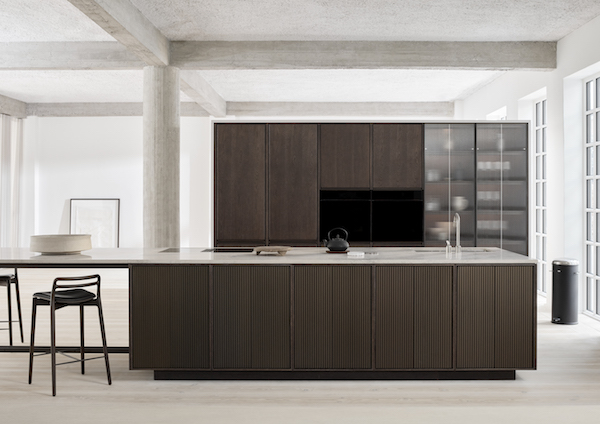 A new kitchen by VIPP in dark oak and jura marble